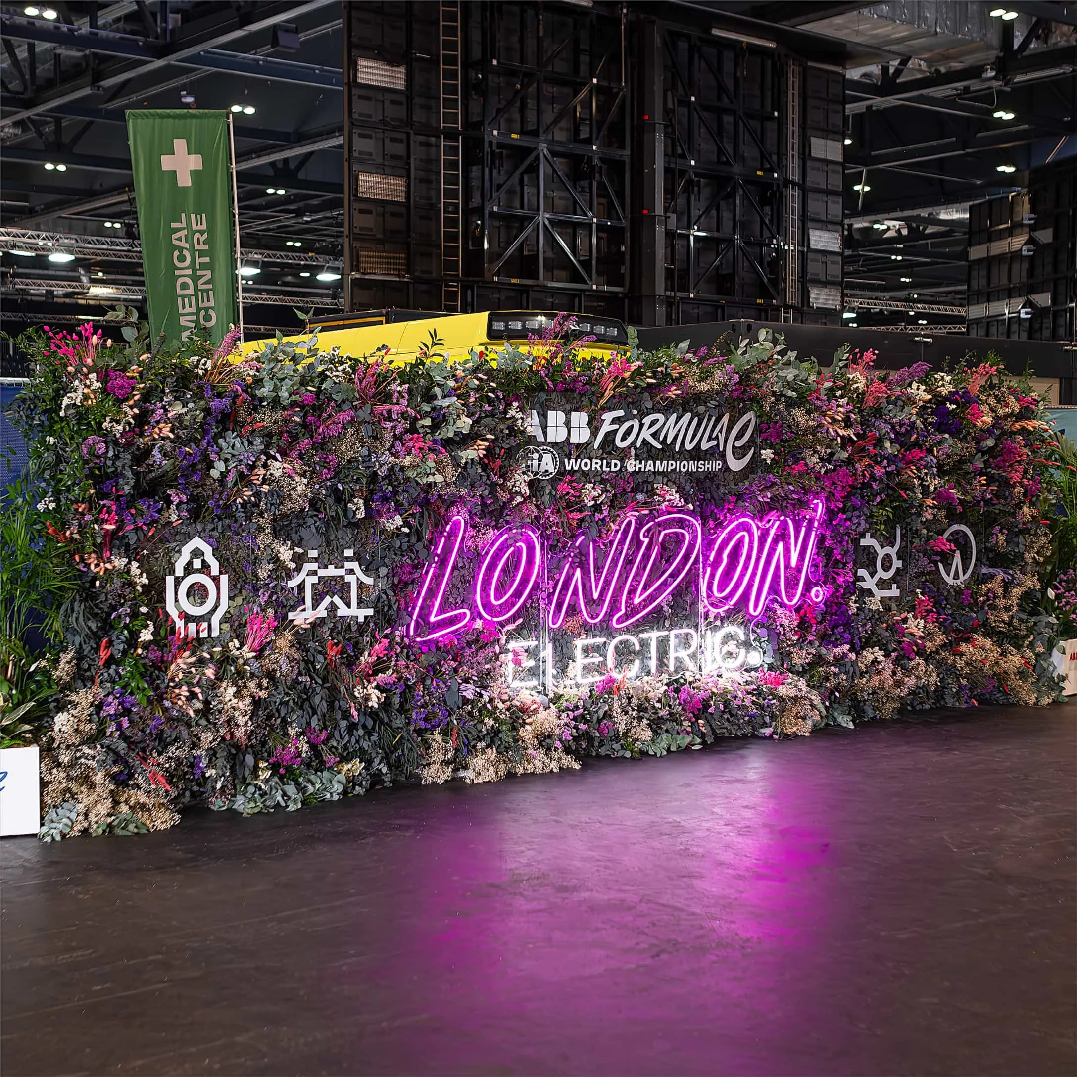 This is a broad view of a floral and plant wall at the Formula E World Championship in London. Our even florists designed this bespoke and extensive floral arrangement with a blend of vibrant flowers and bespoke signage set against a tech-savvy backdrop.
