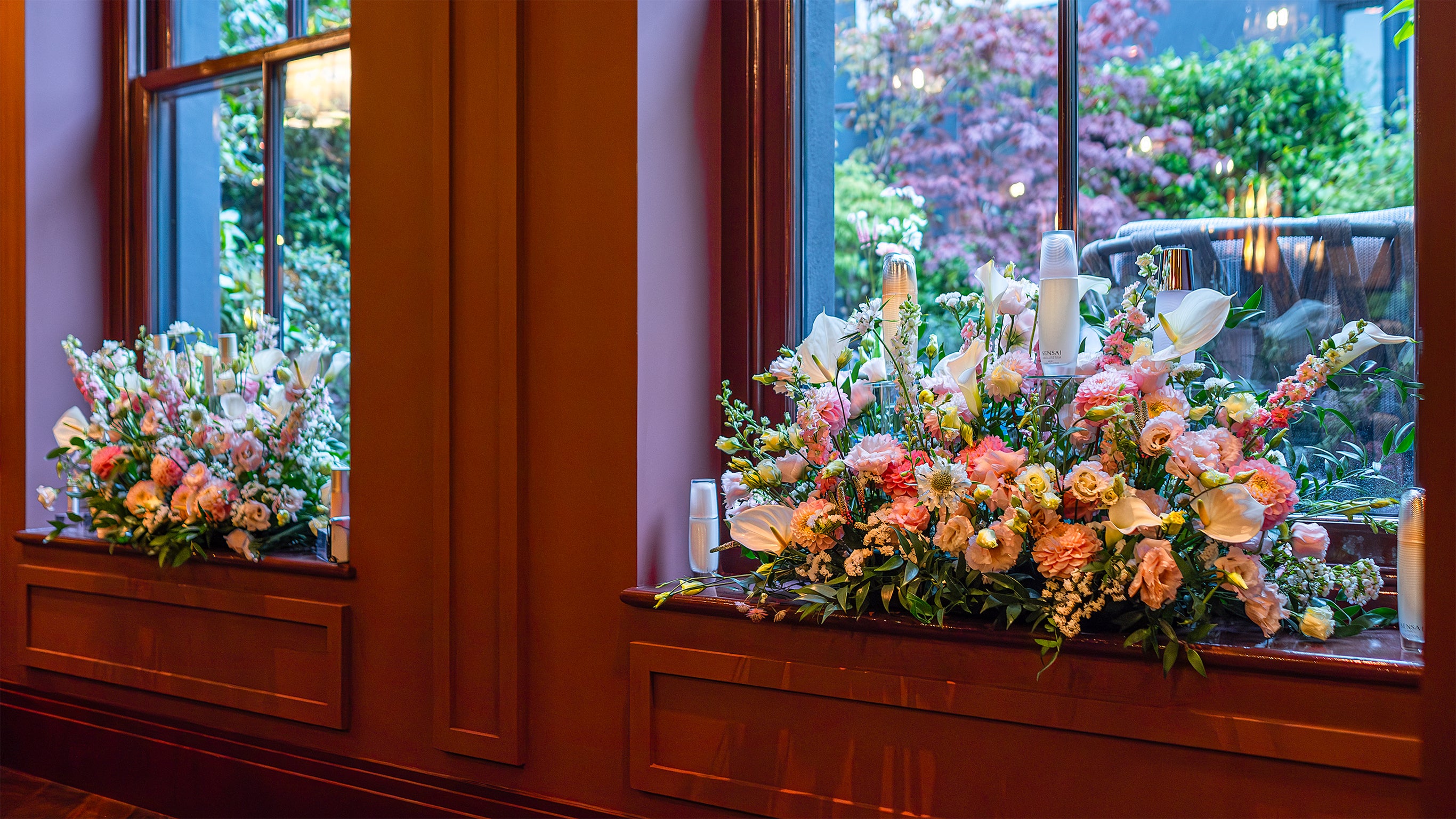 Pink and white Windowsill flower arrangements create a beautiful backdrop for the Sensai product launch - Amaranté London.