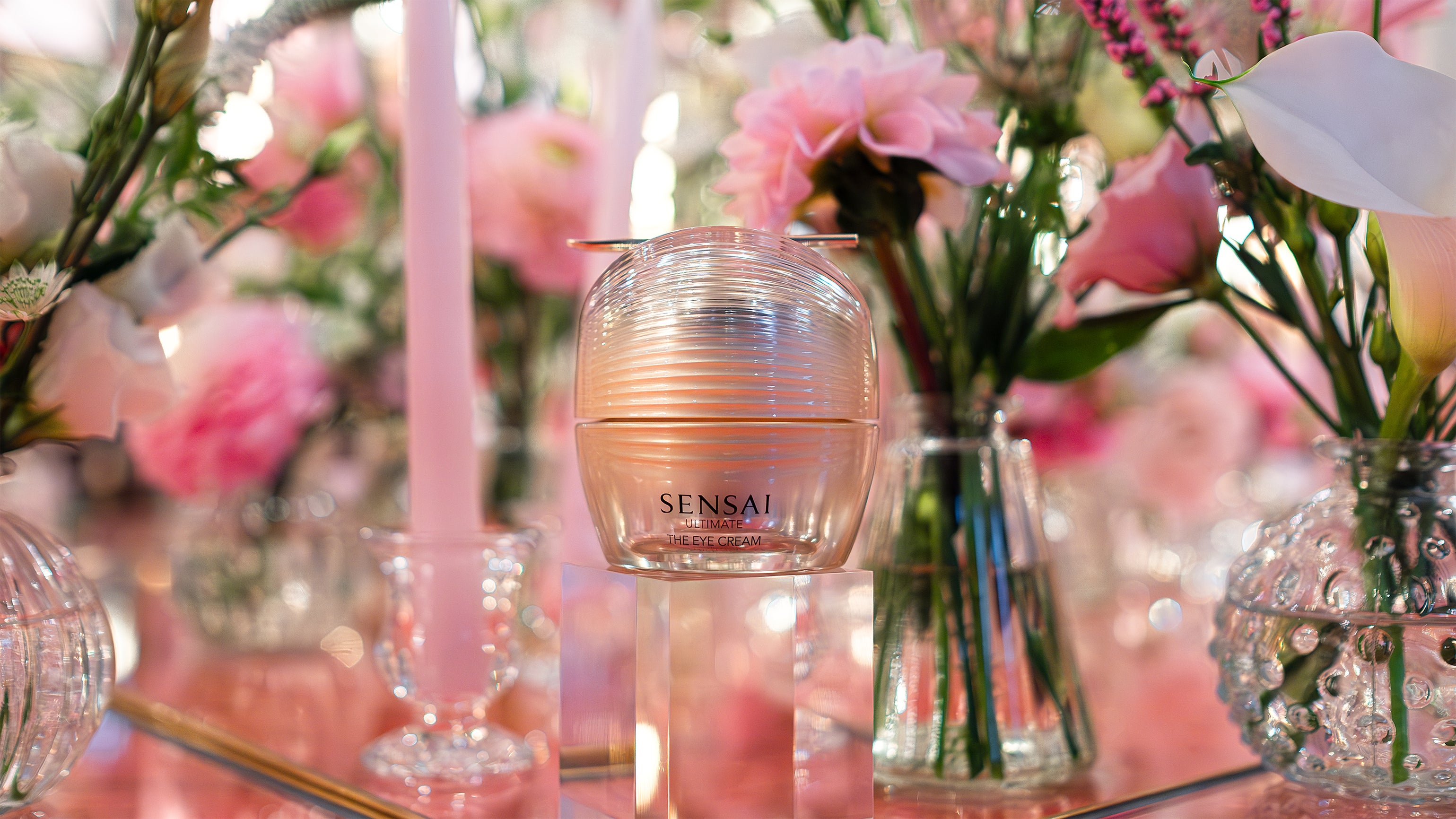 This is a close-up of a pink dahlia amidst a beautiful floral arrangement, designed as part of the decor for The Sensai product launch by Amarante London.