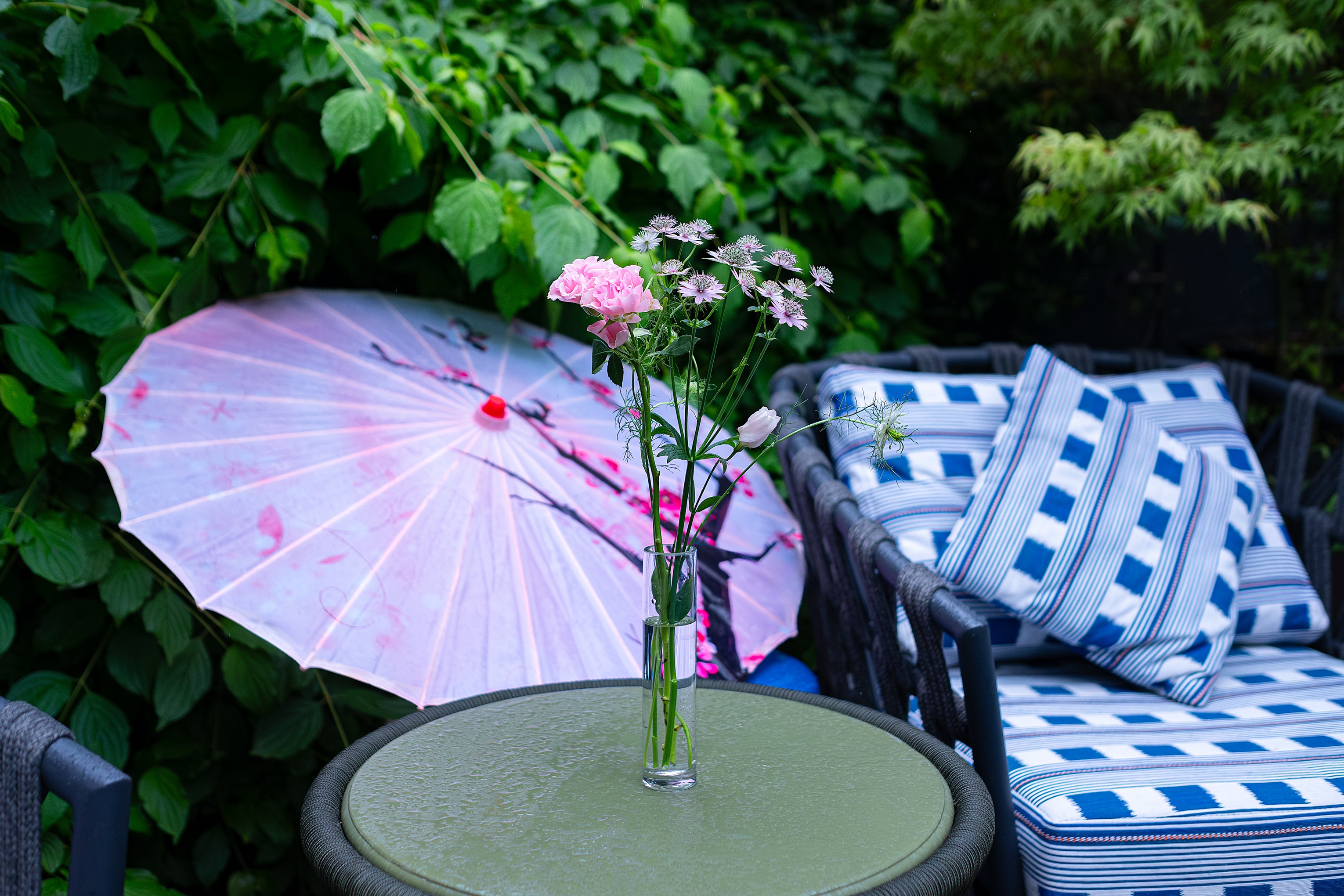 Outdoor terrace decorated with a posy vase of pink and white flowers by Amarante London, adding charm to the Sensai product launch at Beaverbrook Town House.