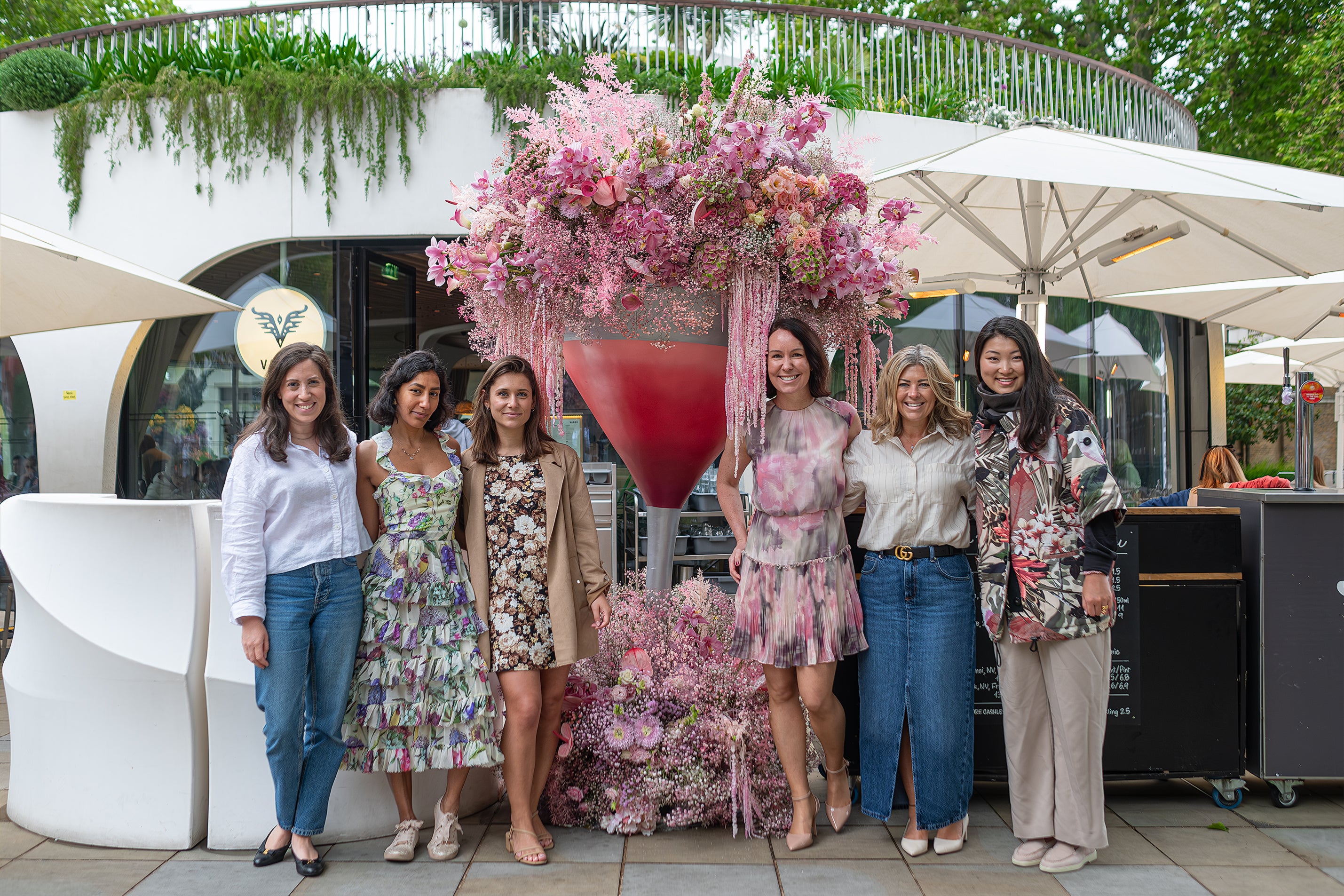 Elegant floral arrangement at the entrance of Vardo, featuring an array of pink and white blooms created by Amaranté London - Floral Arrangements for corporate events and luxury retail environments.