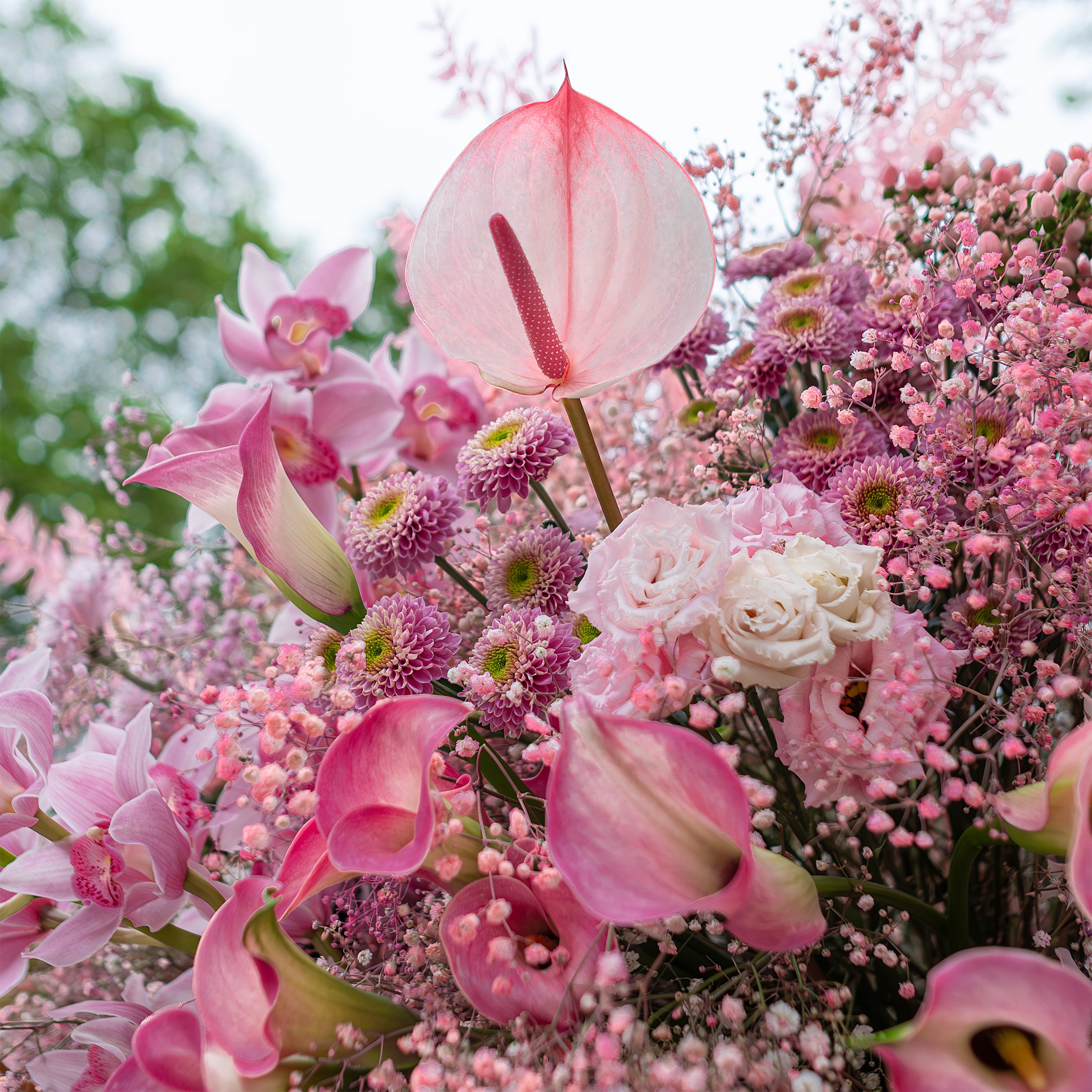 A luscious floral centrepiece at Vardo restaurant, showcasing an abundance of pink blossoms and delicate textures,  tailored for this exclusive event by Event Florist Amaranté London.