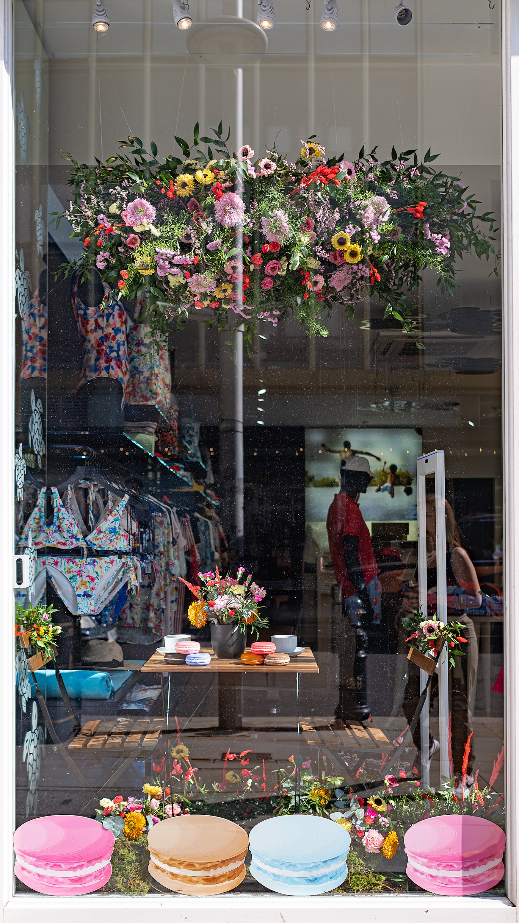 Image of The Vilebrequin storefront in Kings Road decorated with flowers for Chelsea in Bloom - Amarante London 